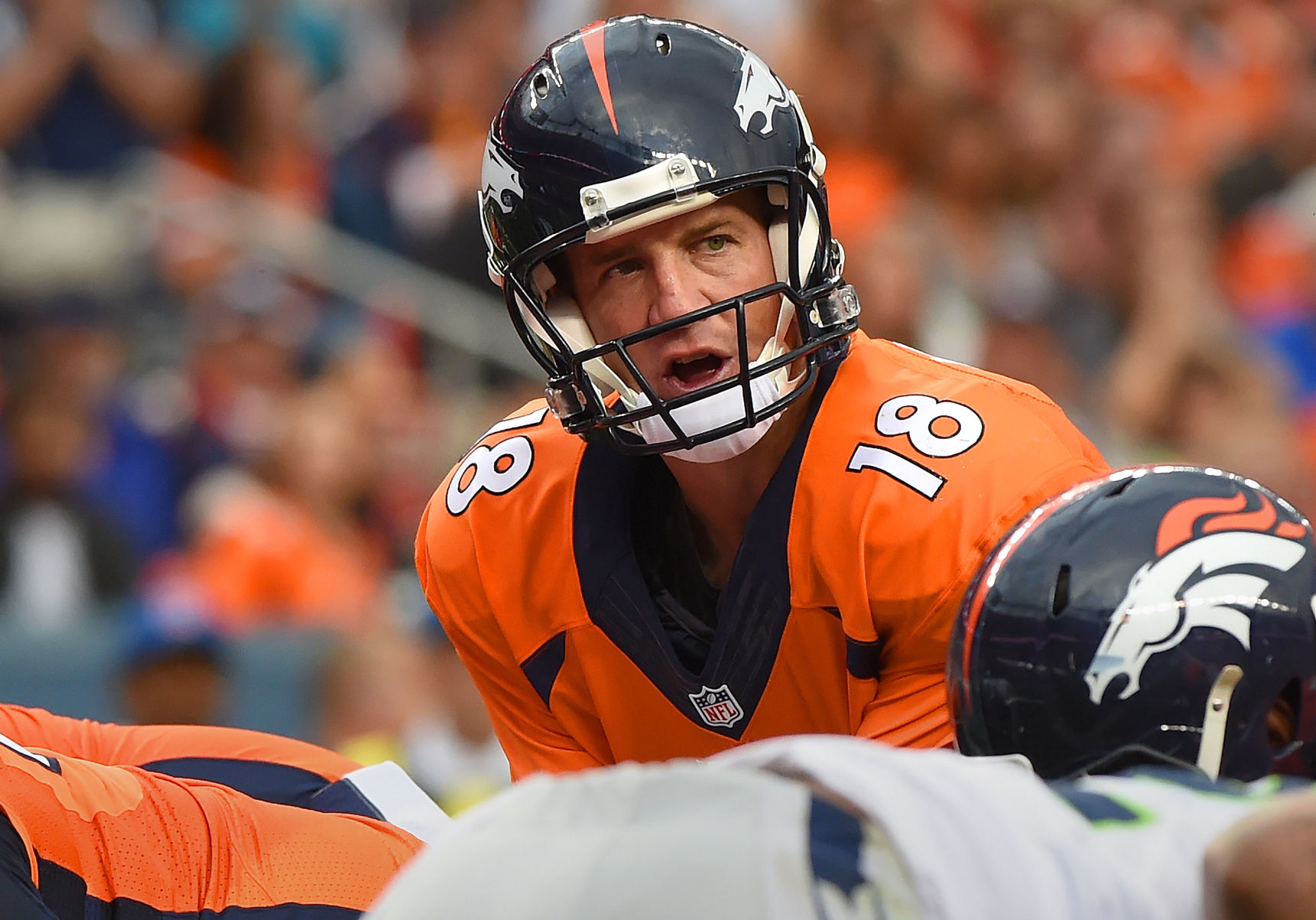 Broncos quarterback Peyton Manning calls signals at the line of scrimmage against Seattle during the first quarter Thursday, Aug. 7, 2014, at Sports Authority Field at Mile High in Denver. (The Gazette, Christian Murdock)